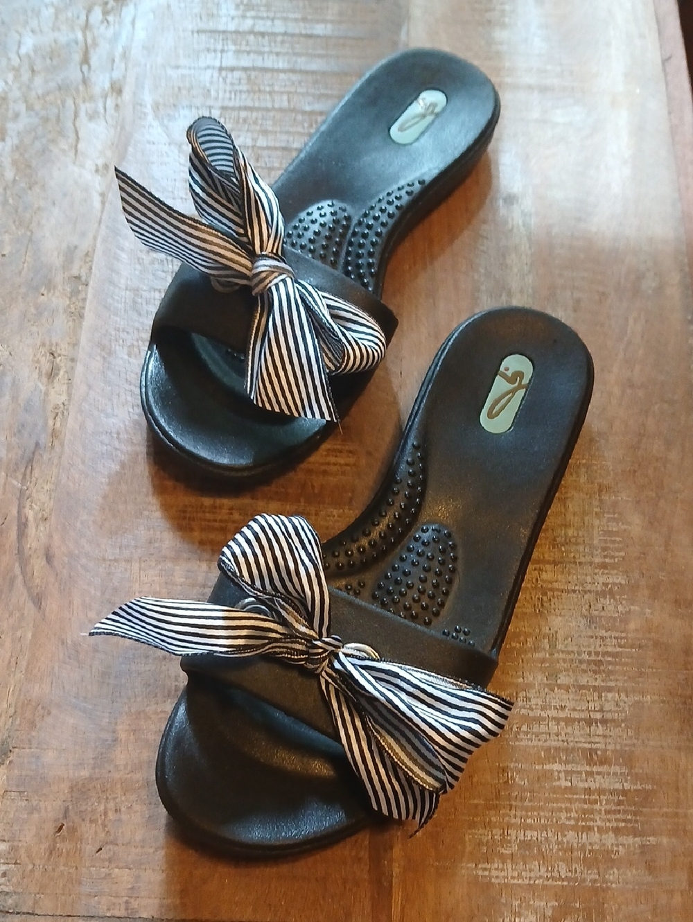 OKA b. Black Slide Sandals with Black-and-White Striped Bow